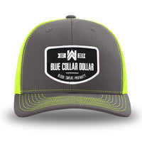 Neon/Safety Yellow and Charcoal Grey two-tone WeWorkin hat—Richardson 112 brand snapback, retro trucker classic hat style. WeWorkin "Blue Collar Dollar" curved-bottom woven patch is centered on the front panels.