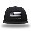 Solid Black WeWorkin hat—Richardson 511 brand snapback, flatbill trucker hat style. AMERICAN FLAG woven patch with black merrowed edge is centered on the front panels.