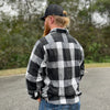 Man pictured from back wearing a We Workin long sleeve Flannel buttoned shirt in Lt Grey/Black Plaid. Also wearing a WW "Everybody Want$ the Money, Nobody Wants the Work" LG Patch, black snapback Hat.