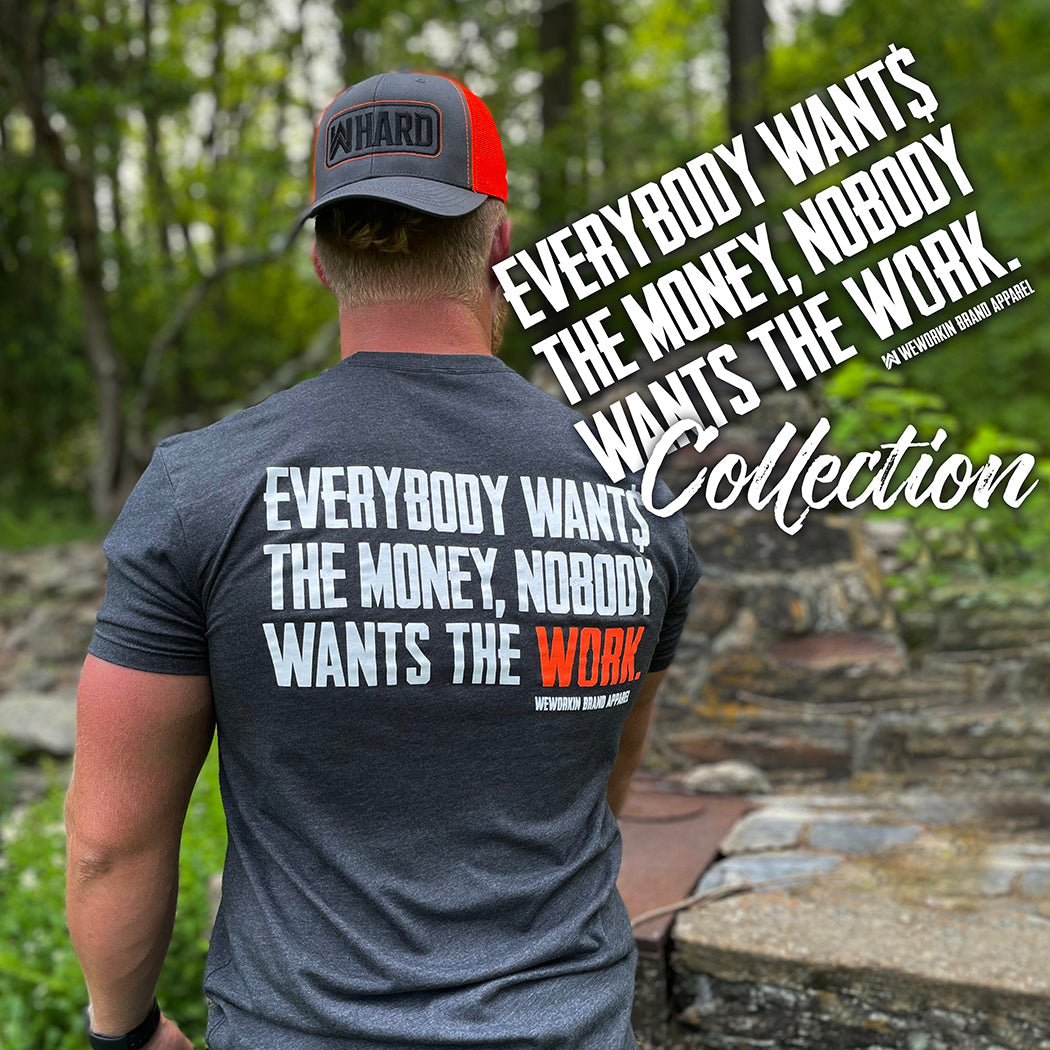 Everybody Want$ The Money...Collection. Man outdoors from back, wearing a WW Everybody Want$ the Money, Nobody Wants the WORK short sleeved tee and WW HARD Charcoal Grey/Neon Orange snapback hat backwards.
