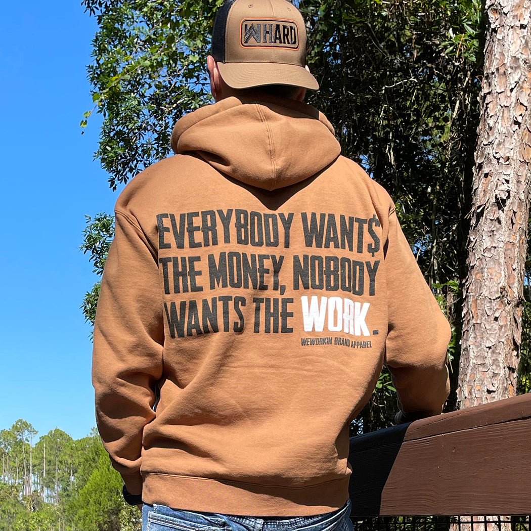 MEN's Hoodie Collection. Man pictured from back wearing a Saddle Brown hoodie with Everybody Want$ the Money, Nobody Wants the Work design and WW HARD Brown/Black hat backwards.