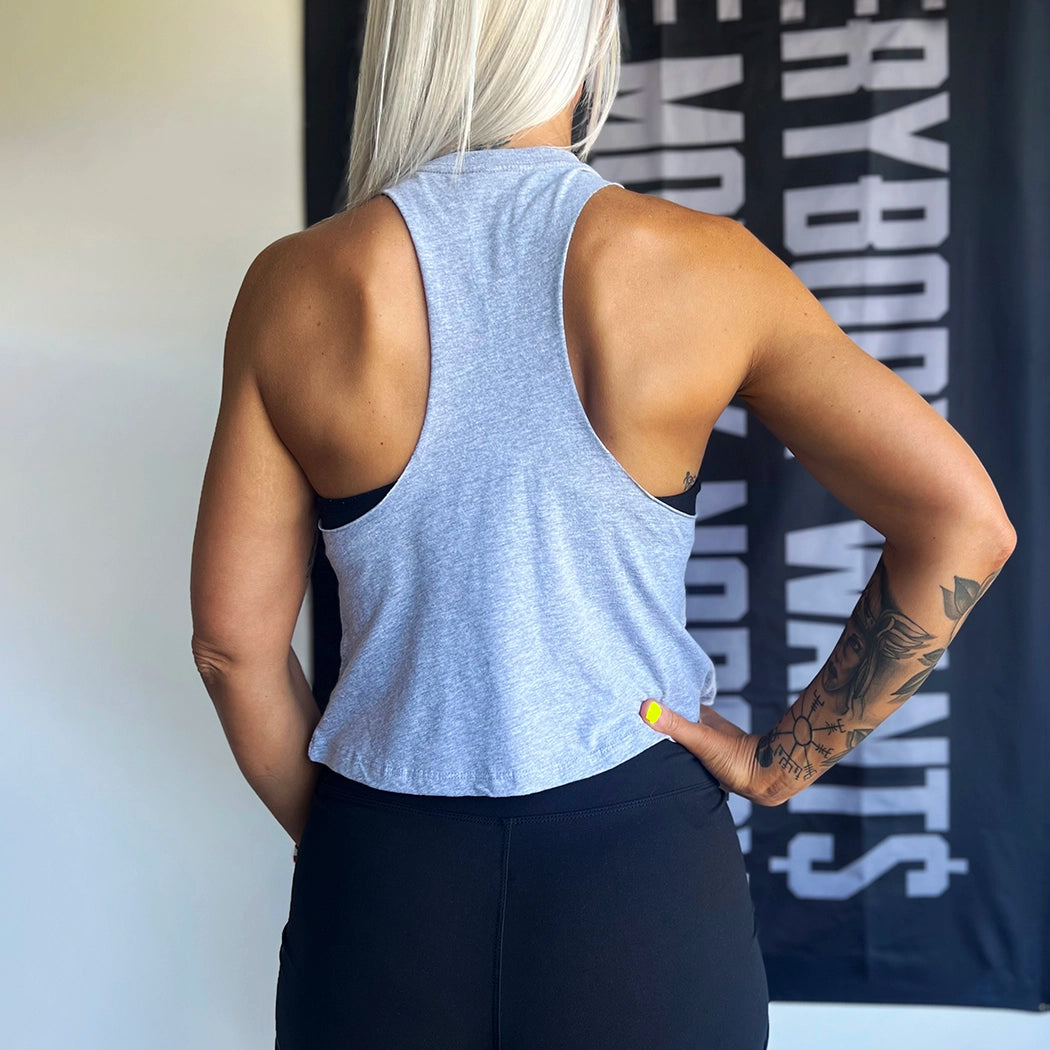 Woman from back, wearing a WW athletic heather grey cropped tank. Racerback cut in a relaxed, cropped fit. This is a blank back (no print).