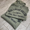 Fronts of the WW "Blue Collar Dollar. Blood. Sweat. Profanity." arched graphic on a Military Green hoodie (2 stacked), screen printed in black ink on front only. 