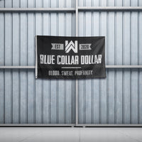 WeWorkin Brand "BLUE COLLAR DOLLAR—Blood. Sweat. Profanity." flag hung on metal sliding doors. Each flag measures approx. 5'w x 3'h, black background with grey/white letters. White, double-stitched, thicker left edge for durability, (2) grommets (one at top left and one at bottom left corners).