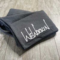 WeWorkin Brand script logo in white ink on our oversized stadium blanket in Heather Charcoal Grey color.