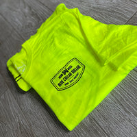 2 folded We Workin Hi-Viz long sleeve tees in Safety Yellow on wood tile background. Front of tee is printed with the We Workin BLUE COLLAR DOLLAR. BLOOD. SWEAT. PROFANITY. design in smaller left "pocket" size, printed in Black ink.
