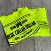 2 folded/stacked We Workin Hi-Viz short sleeve tees in Safety Yellow on wood tile background. Front of tee is printed with the We Workin BLUE COLLAR DOLLAR. BLOOD. SWEAT. PROFANITY. design in smaller left "pocket" size and back is same design but large, both printed in Black ink.