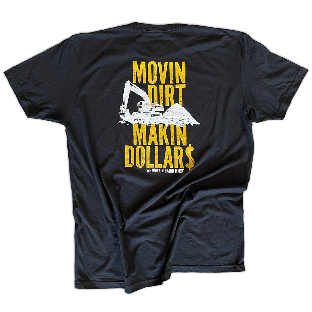 A "MOVIN DIRT. MAKIN DOLLAR$." WW black tee. Distressed text with a track hoe movin dirt in the center. Graphic is printed large in the center/upper back, in gold and white ink on a white background.