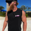 Man wearing a WW black muscle tank, shown from front. "WE WORKIN" script text with Neon Pink swashes under text, is printed on the left chest "pocket" area. Printed in White and Neon Pink inks.