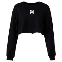 Front of a We Workin women’s cropped long sleeved tee in black, on white background. Small printed WW icon on center chest near neckline, in white ink.