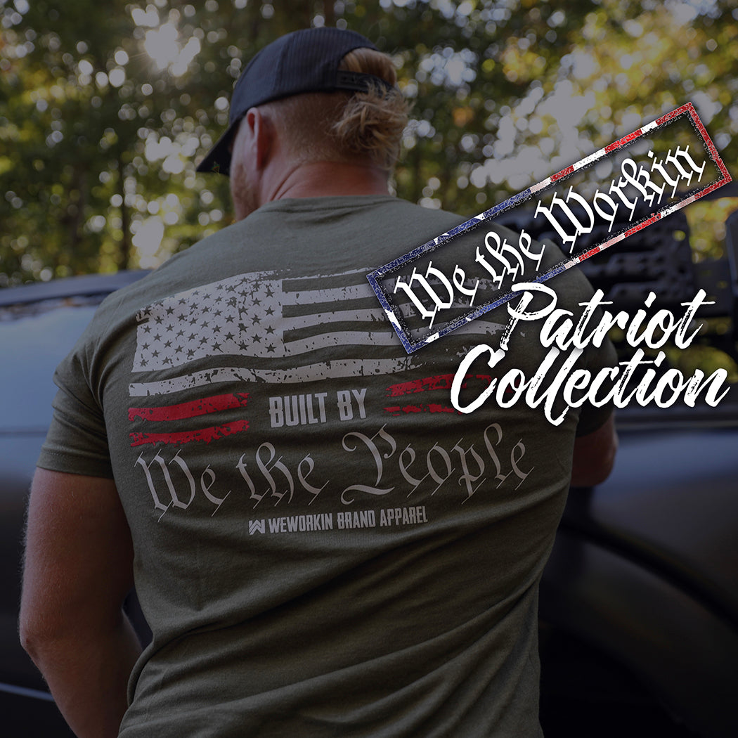 PATRIOT COLLECTION. Man standing by truck, from back, wearing a We The Workin. Built By We The People tee.