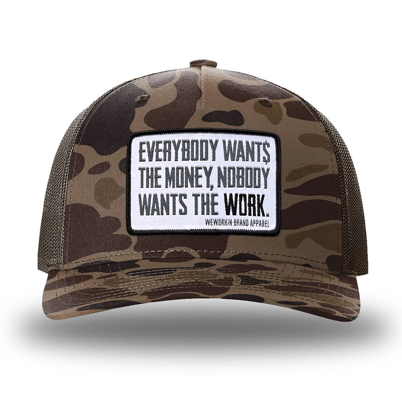 Bark Duck Camo/Brown two-tone WeWorkin hat—Richardson 112PFP snapback, 5-panel trucker, mesh-back style. WeWorkin "Everybody Want$ the Money, Nobody Wants the WORK." [white bkgd] rectangular woven patch is centered on the front panel.