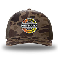 Bark Duck Camo/Brown two-tone WeWorkin hat—Richardson 112PFP snapback, 5-panel trucker, mesh-back style. WE WORKIN custom GET HARD patch made of thermoplastic, lightweight, durable material is centered on the front panels in orange to yellow fade and black colors.