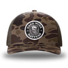 Bark Duck Camo/Brown two-tone WeWorkin hat—Richardson 112PFP snapback, 5-panel trucker, mesh-back style. HARD WORK MATTERS woven patch with white merrowed edge, on a black background with HARD WORK MATTERS text encircling a Viking-style skull center graphic with MM XX on the left and right respectively—patch is centered on the front panels.