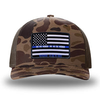 Bark Duck Camo/Brown two-tone WeWorkin hat—Richardson 112PFP snapback, 5-panel trucker, mesh-back style. LEO FLAG woven patch with black merrowed edge is centered on the front panel.
