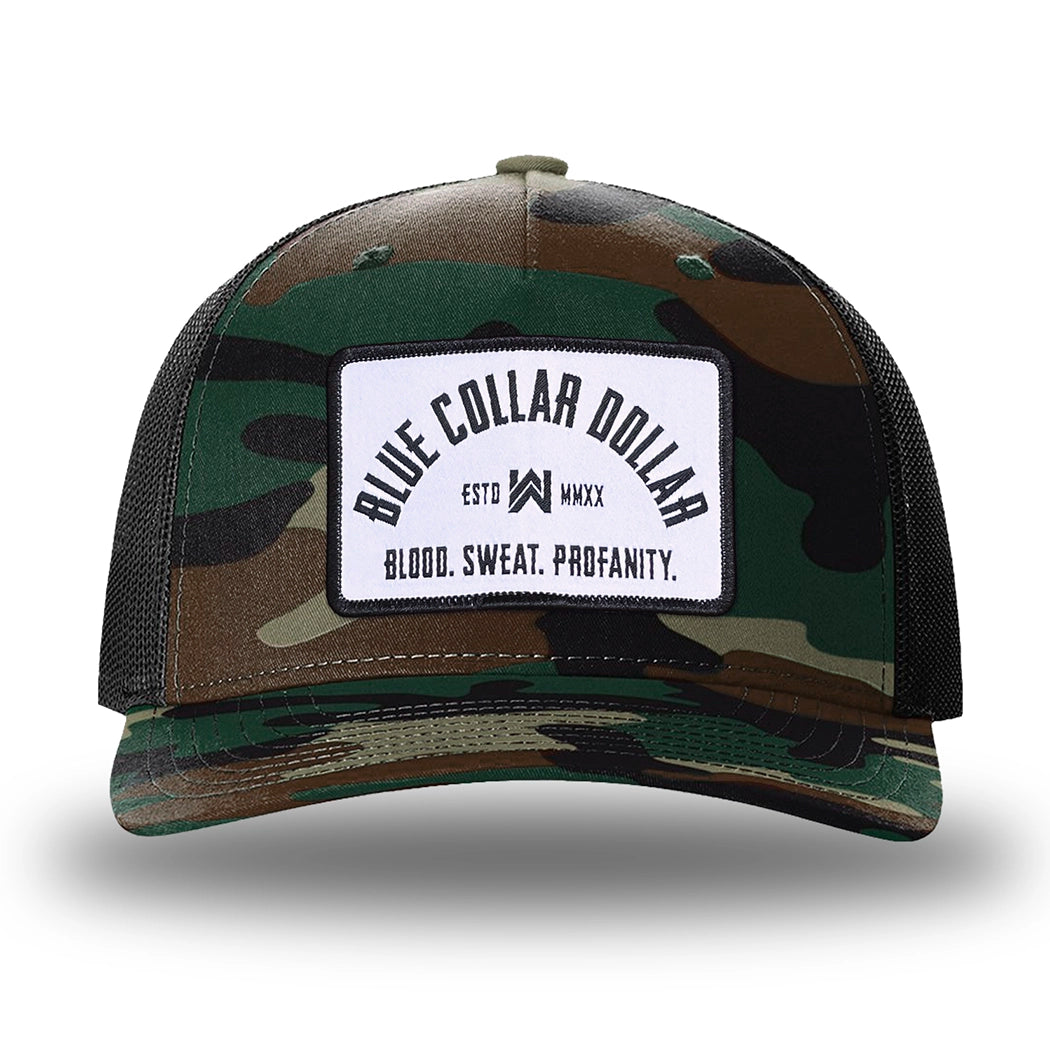 Green Camo/Black two-tone WeWorkin hat—Richardson 112PFP snapback, 5-panel trucker, mesh-back style. BLUE COLLAR DOLLAR ARCH (BCD-ARCH) woven patch with black merrowed edge, on a white background with black text, is centered on the front panel.