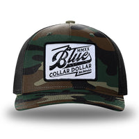 Green Camo/Black two-tone WeWorkin hat—Richardson 112PFP snapback, 5-panel trucker, mesh-back style. We Workin "Blue Collar Dollar VINTAGE" (BCD-V) woven patch with black merrowed edge, on a white background with black distressed text/graphic, is centered on the front panel.