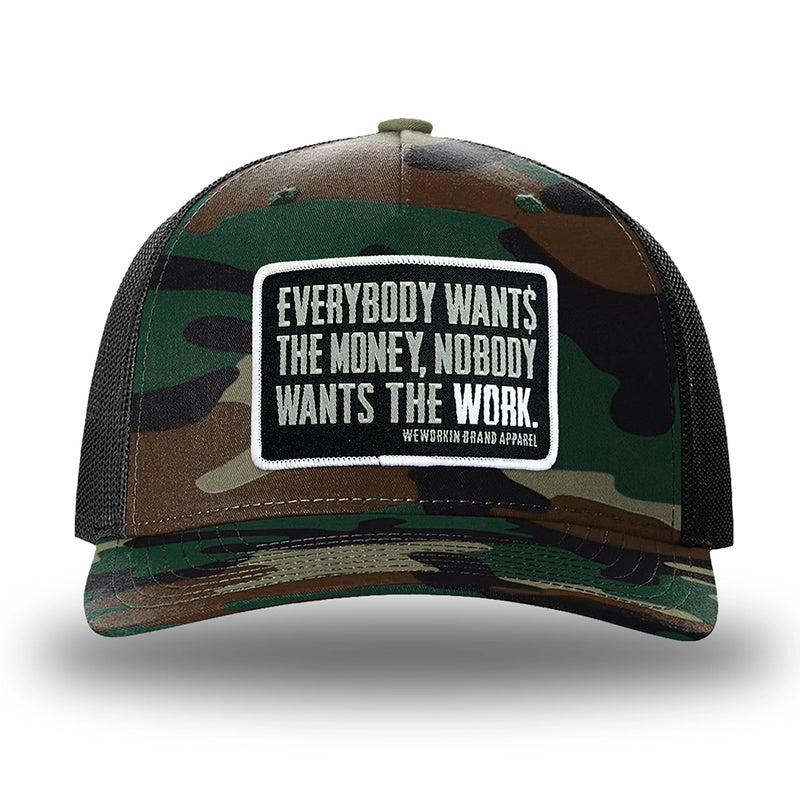 Green Camo/Black two-tone WeWorkin hat—Richardson 112PFP snapback, 5-panel trucker, mesh-back style. WeWorkin "Everybody Want$ the Money, Nobody Wants the WORK." rectangular woven patch is centered on the front panel.