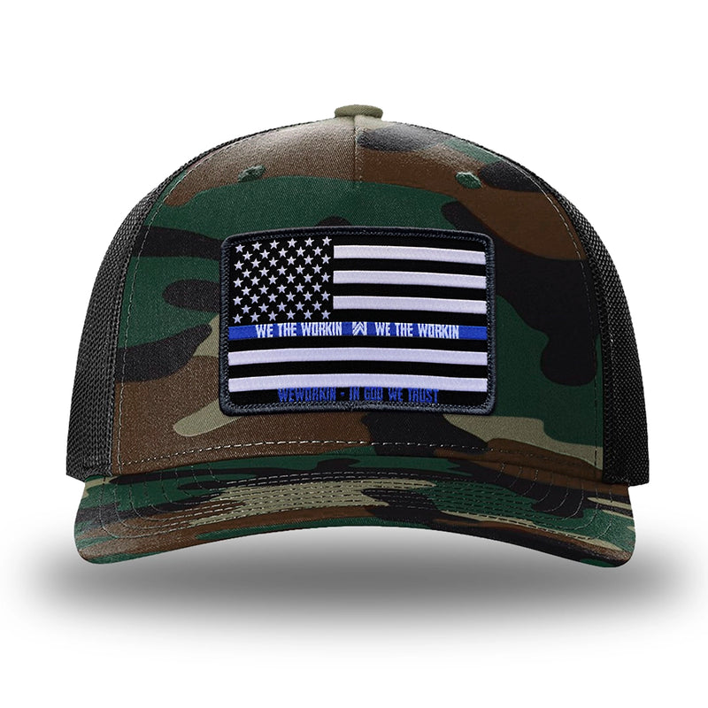 Green Camo/Black two-tone WeWorkin hat—Richardson 112PFP snapback, 5-panel trucker, mesh-back style. LEO FLAG woven patch with black merrowed edge is centered on the front panel.