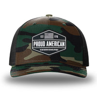 Green Camo/Black two-tone WeWorkin hat—Richardson 112PFP snapback, 5-panel trucker, mesh-back style. WeWorkin "PROUD AMERICAN" silicone patch is centered on the front panel.