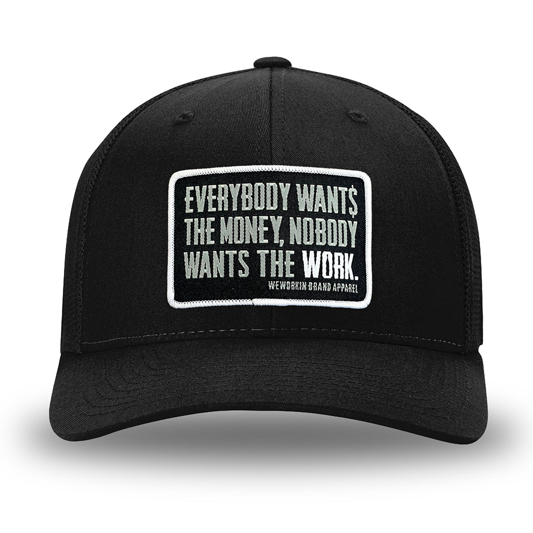 All Black Flex Fit style WeWorkin hat—Woven front with Poly mesh sides and back, Richardson 110 brand (R-Flex trucker). WeWorkin "Everybody Want$ the Money, Nobody Wants the WORK." rectangular woven patch is centered on the front panels.