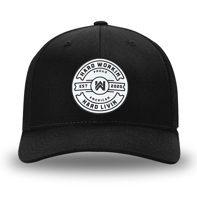 All Black Flex Fit style WeWorkin hat—Woven front with Poly mesh sides and back, Richardson 110 brand (R-Flex trucker). WeWorkin "Hard Workin. Hard Livin. Proud American." circular PVC patch is centered on the front panels.