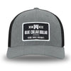 Heather Grey/Black Flex Fit style WeWorkin hat—Woven front with Poly mesh sides and back, Richardson 110 brand (R-Flex trucker). WeWorkin "Blue Collar Dollar" rectangular woven patch is centered on the front.