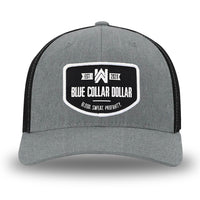 Heather Grey/Black Flex Fit style WeWorkin hat—Woven front with Poly mesh sides and back, Richardson 110 brand (R-Flex trucker). WeWorkin "Blue Collar Dollar" curved-bottom woven patch is centered on the front panels.
