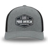 Heather Grey/Black Flex Fit style WeWorkin hat—Woven front with Poly mesh sides and back, Richardson 110 brand (R-Flex trucker). WeWorkin "PROUD AMERICAN" PVC patch is centered on the front panels.
