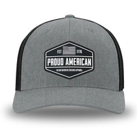 Heather Grey/Black Flex Fit style WeWorkin hat—Woven front with Poly mesh sides and back, Richardson 110 brand (R-Flex trucker). WeWorkin "PROUD AMERICAN" PVC patch is centered on the front panels.