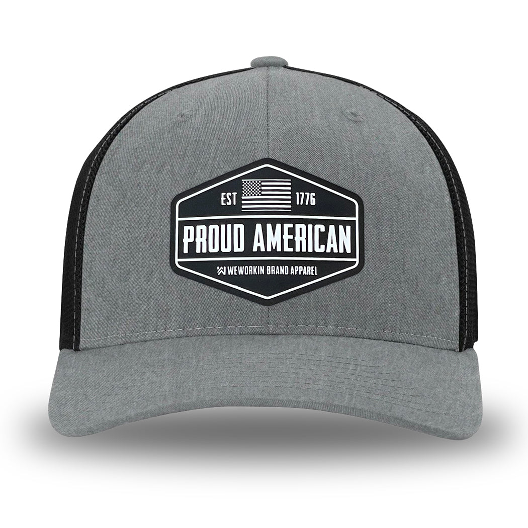 Heather Grey/Black Flex Fit style WeWorkin hat—Woven front with Poly mesh sides and back, Richardson 110 brand (R-Flex trucker). WeWorkin "PROUD AMERICAN" silicone patch is centered on the front panels.
