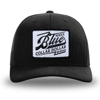 Solid Black WeWorkin hat—Richardson 112 brand snapback, retro trucker classic hat style. BLUE COLLAR DOLLAR VINTAGE (BCD-V) woven patch with black merrowed edge, on a white background with black, distressed text/design, centered on the front panels.