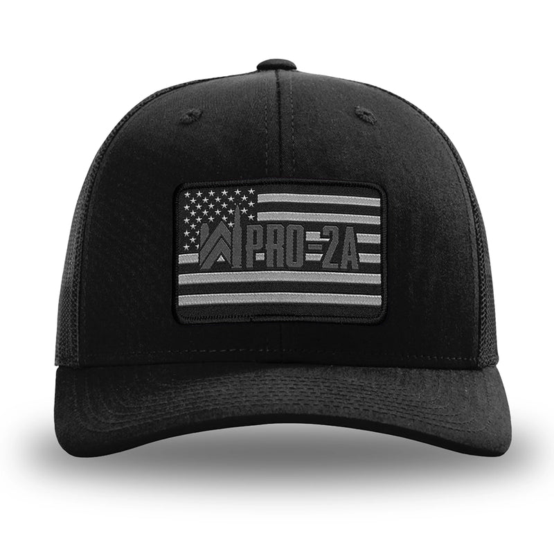 Solid Black WeWorkin hat—Richardson 112 brand snapback, retro trucker classic hat style. PRO-2A woven patch with black merrowed edge is centered on the front panels.