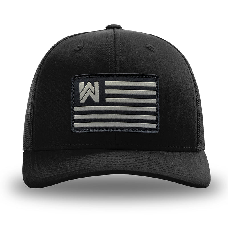 Solid Black WeWorkin hat—Richardson 112 brand snapback, retro trucker classic hat style. WE WORKIN FLAG woven patch with black merrowed edge is centered on the front panels.