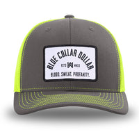 Neon/Safety Yellow and Charcoal Grey two-tone WeWorkin hat—Richardson 112 brand snapback, retro trucker classic hat style. BLUE COLLAR DOLLAR ARCH (BCD-ARCH) woven patch with black merrowed edge, on a white background with black text, is centered on the front panels.