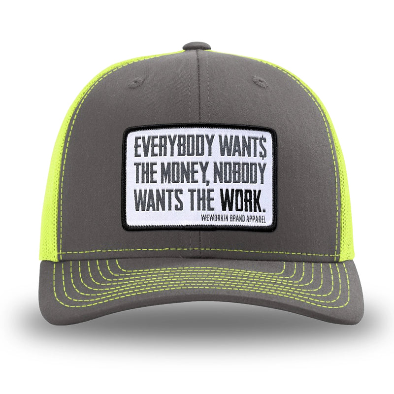 Neon/Safety Yellow and Charcoal Grey two-tone WeWorkin hat—Richardson 112 brand snapback, retro trucker classic hat style. WeWorkin "Everybody Want$ the Money, Nobody Wants the WORK." [White Bkgd] rectangular woven patch is centered on the front panels.