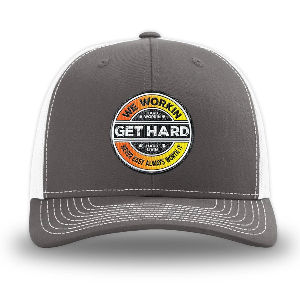 Charcoal/White WeWorkin hat—Richardson 112 brand snapback, retro trucker classic hat style. WE WORKIN custom GET HARD patch made of thermoplastic, lightweight, durable material is centered on the front panels in orange to yellow fade and black colors.