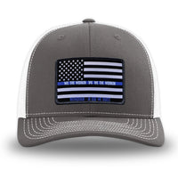 Charcoal/White WeWorkin hat—Richardson 112 brand snapback, retro trucker classic hat style. LEO FLAG woven patch with black merrowed edge is centered on the front panels.