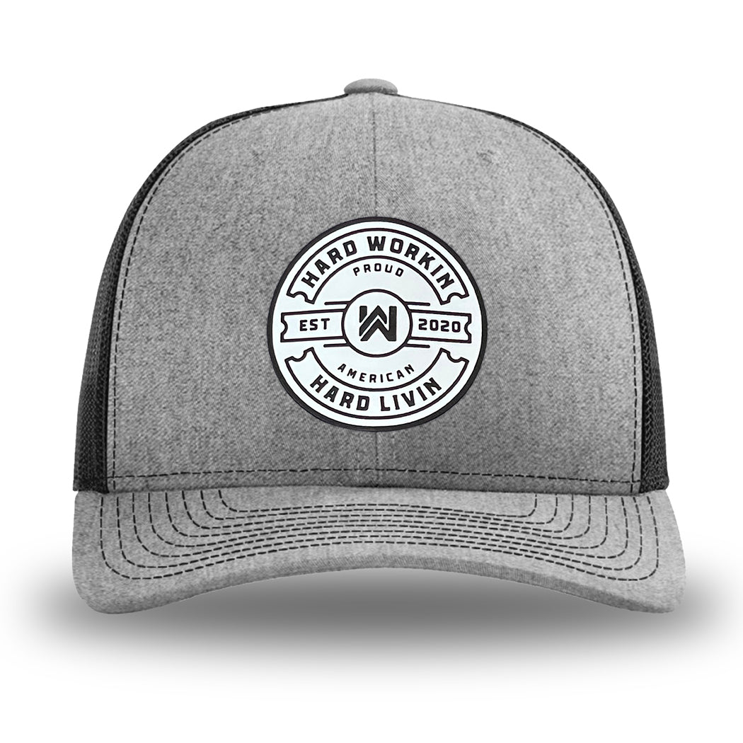 Heather Grey/Black WeWorkin hat—Richardson 112 brand snapback, retro trucker classic hat style. "HARD WORKIN. HARD LIVIN." Proud American silicone circle patch is centered on the front panels.