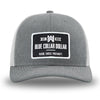 Heather Grey front panels/brim and Light Grey side/back mesh panels for this two-tone WeWorkin hat—Richardson 112 brand snapback, retro trucker style. WeWorkin "Blue Collar Dollar" rectangular woven patch is centered on the front panels.