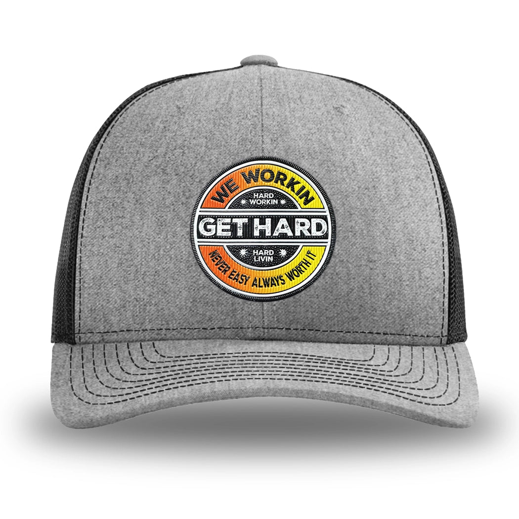Heather Grey/Black WeWorkin hat—Richardson 112 brand snapback, retro trucker classic hat style. WE WORKIN custom GET HARD patch made of thermoplastic, lightweight, durable material is centered on the front panels in orange to yellow fade and black colors.
