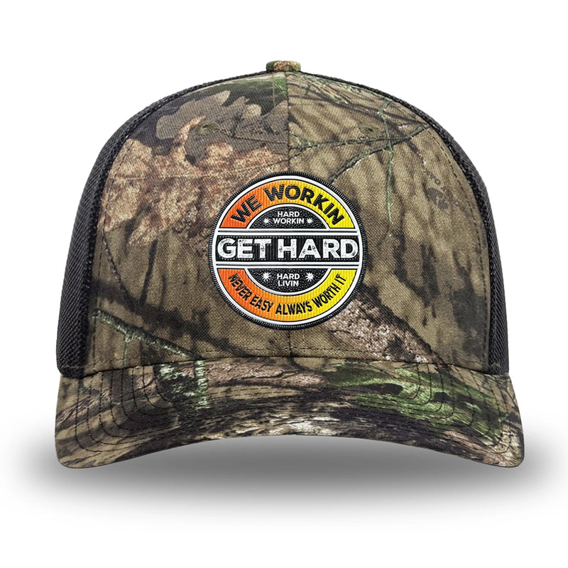 Mossy Oak/Country DNA/Black WeWorkin hat—Richardson 112 brand snapback, retro trucker classic hat style. WE WORKIN custom WE WORKIN custom GET HARD patch made of thermoplastic, lightweight, durable material is centered on the front panels in orange to yellow fade and black colors.