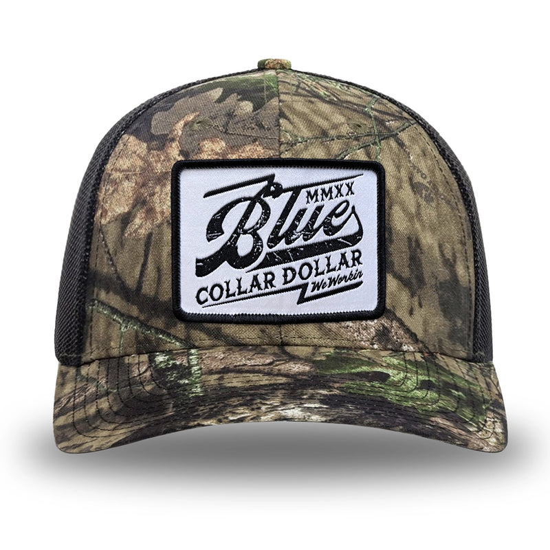 Mossy Oak/Country DNA/Black WeWorkin hat—Richardson 112 brand snapback, retro trucker classic hat style. BLUE COLLAR DOLLAR VINTAGE (BCD-V) woven patch with black merrowed edge, on a white background with black, distressed text/design, centered on the front panels.