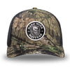 Mossy Oak/Country DNA/Black WeWorkin hat—Richardson 112 brand snapback, retro trucker classic hat style. HARD WORK MATTERS woven patch with white merrowed edge, on a black background with HARD WORK MATTERS text encircling a Viking-style skull center graphic with MM XX on the left and right respectively—patch is centered on the front panels.