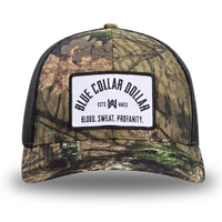 Mossy Oak/Country DNA/Black WeWorkin hat—Richardson 112 brand snapback, retro trucker classic hat style. BLUE COLLAR DOLLAR ARCH (BCD-ARCH) woven patch with black merrowed edge, on a white background with black text, is centered on the front panels.