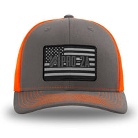 Neon/Safety Orange and Charcoal Grey two-tone WeWorkin hat—Richardson 112 brand snapback, retro trucker classic hat style. PRO-2A woven patch with black merrowed edge is centered on the front panels.