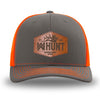 Neon/Safety Orange and Charcoal Grey two-tone WeWorkin hat—Richardson 112 brand snapback, retro trucker classic hat style. WeWorkin "WW HUNT" etched leather patch with stitched border is centered on the front panels.