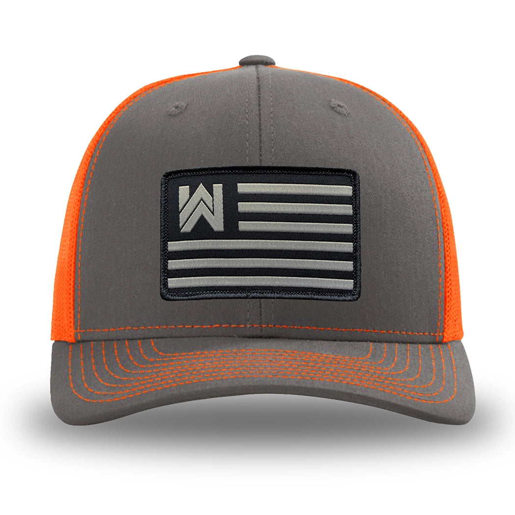 Neon/Safety Orange and Charcoal Grey two-tone WeWorkin hat—Richardson 112 brand snapback, retro trucker classic hat style. We Workin Flag rectangular patch is centered on the front panels.