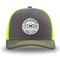 Neon/Safety Yellow and Charcoal Grey two-tone WeWorkin hat—Richardson 112 brand snapback, retro trucker classic hat style. WeWorkin "Hard Workin. Hard Livin. Proud American." circular PVC patch is centered on the front panels.