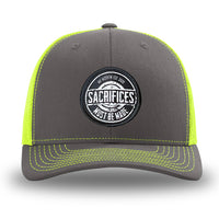 Neon/Safety Yellow and Charcoal Grey two-tone WeWorkin hat—Richardson 112 brand snapback, retro trucker classic hat style. WeWorkin "SACRIFICES MUST BE MADE" circular woven patch is centered on the front panels.
